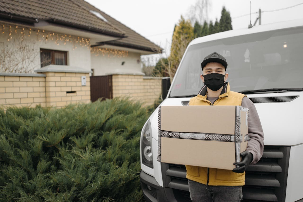 Deliveryman Carrying a Cardboard Box